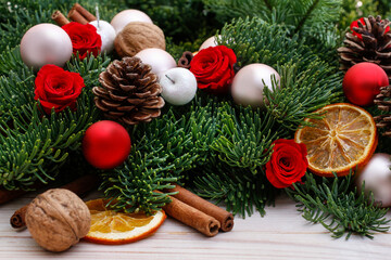 Traditional Christmas garland with fir, cones, baubles and dried oranges.