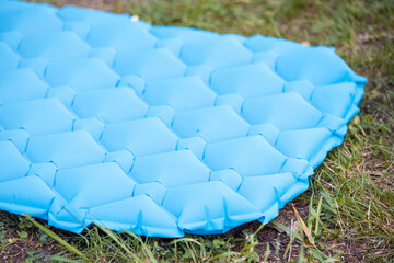 inflatable mat for a comfortable and warm sleep in a tent camping in nature. Reliable reflection of...
