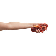 a man's hand holds a piece of raw meat. isolated on white