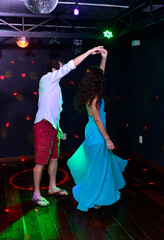 couple dancing waltz in nightclub
