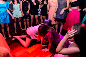 group of teenager dancing in nightclub