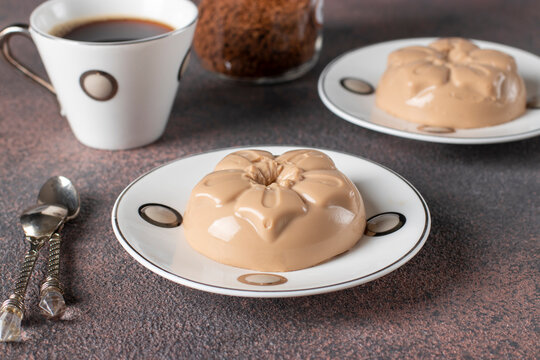 Coffee Dessert Made From Cream And Gelatin In Portion Molds On A Brown Background. Dessert Blancmange