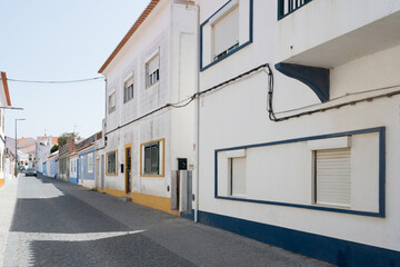 Fototapeta na wymiar Empty street at Vila Nova de Milfontes in a hot day. Alentejo, Portugal