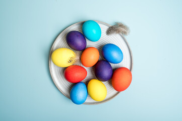 Coloured decorated easter eggs on a blue background