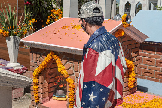 Mexican American Worker Visiting Graveyard In The Day Of The Dead In Mexico
An Illegal Worker Returning From USA To Visit A Diseased Family Member
