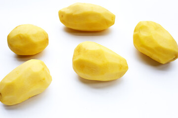 Raw peeled potatoes on white background