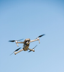 Fototapeta na wymiar quadrocopter in flight above the ground photo of the unit itself