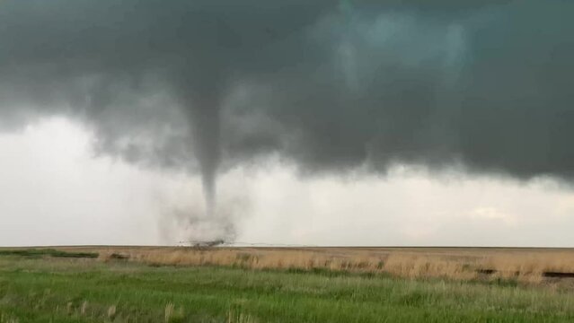 Strong tornado over a field in Kansas