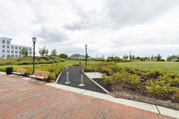 A paved walking path leads into RCA Pier Park, an urban revitalization project on the Delaware River waterfront in Camden, New Jersey, USA