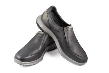 Black leather shoes isolated on white background. Full depth of field. Close-up.