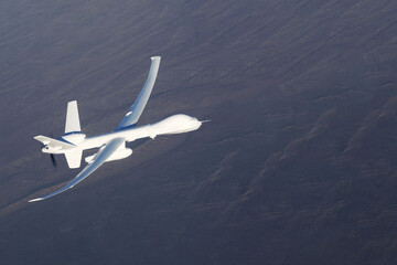 UAV flies over the earth. Elements of this image furnished by NASA