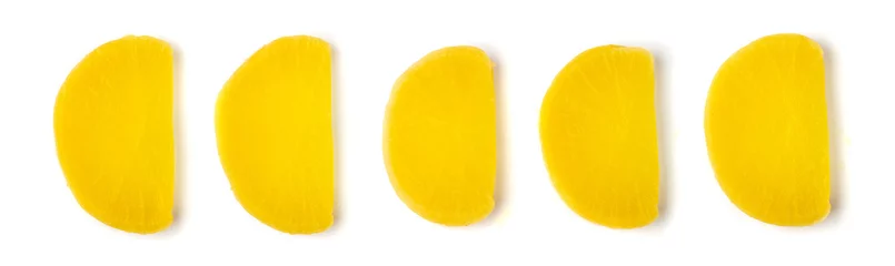 Photo sur Plexiglas Légumes frais Pickled Daikon Bars Isolated, Marinated Yellow Radish