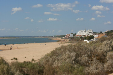Fototapeta na wymiar beach day with white sands and blue sea in huelva spain