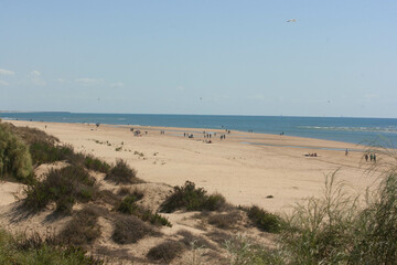 beach day with white sands and blue sea in huelva spain