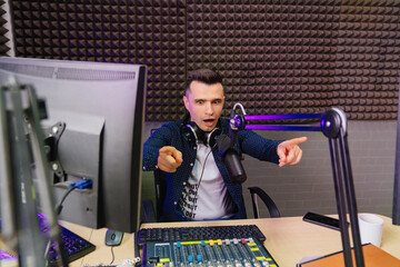 cheery radio in a shirt host broadcasts live reads news on computer screen.