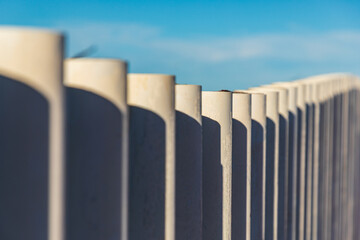A row of posts along the shore.