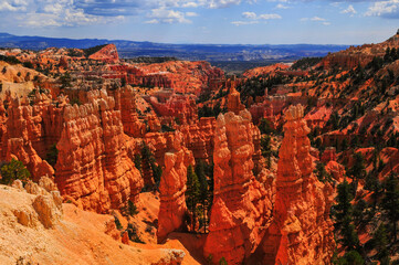 Midday view of the hoodoos and rock spires of Bryce Canyon National Park from Sunset Point, Utah,...