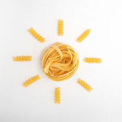 Creative flat lay pasta made yellow summer sun