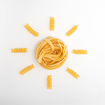 Creative flat lay pasta made yellow summer sun