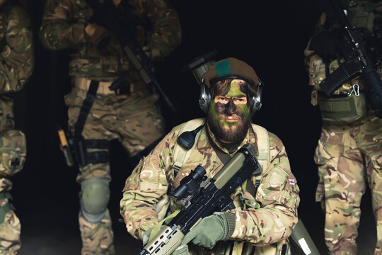Tough beardo veteran soldier posing for media pictures. High quality photo