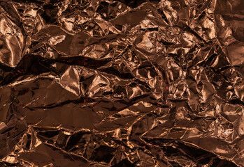 Abstract texture pattern metallic paper using as a background or wallpaper. Metal aluminum foil shiny and reflector