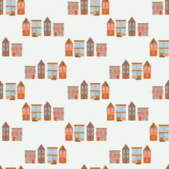 Fototapeta premium Beautiful cute brick houses. Seamless pattern with houses in pastel shades