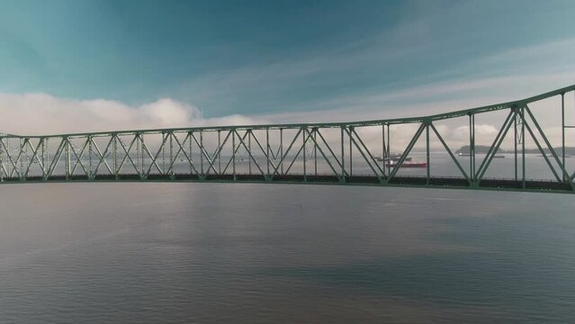 4K Aerial Big steel bridge on Columbia river in Oregon Drone dolly in shot on the middle of the bridge