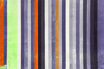 Grunge concrete wall with colorful stripes