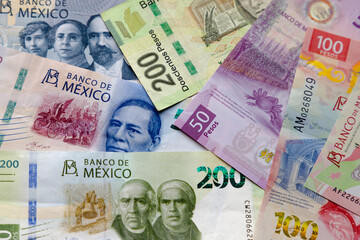 Several Mexican Banknotes of different currencies. Concept: Inflation volatility