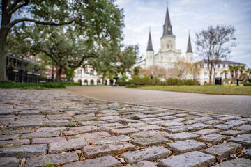 Cobblestone street in view in Jackson Square, French Quarter, New Orleans, with the St. Louis...
