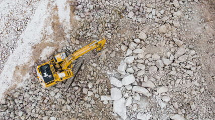 the excavator splits the stones. career equipment. © suvorovalex