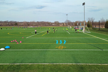 Boys practicing soccer on a multi-use ball field