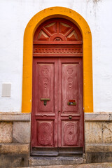 Fototapeta na wymiar Old and beautiful ornate door in Andalusia