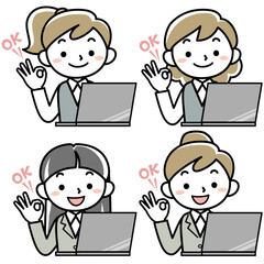 ノートパソコンの前でOKサインをする女性会社員の上半身