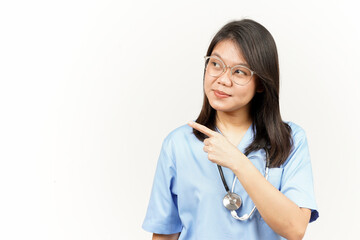 Showing Product and Pointing Side Of Asian Young Doctor Isolated On White Background