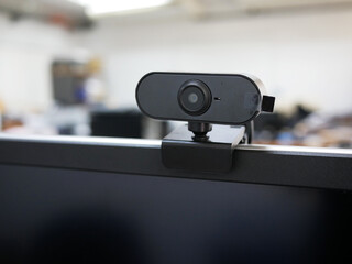 HD web cam installed on computer monitor for business meting.