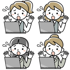 ノートパソコンを見て慌てる女性社員の上半身
