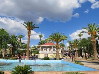 Fototapeta premium pool with kiosk, palm trees in the background, Jesus Maria, Aguascalientes, Mexico