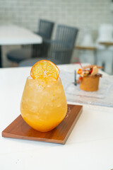 orange juice with soda on table