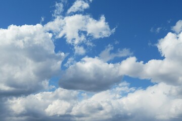 Naklejka na ściany i meble Beautiful fluffy shapes clouds in the sky, natural background