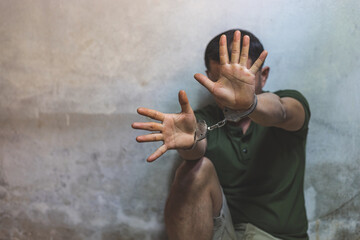 prisoner concept,Handcuffed hands of a prisoner in prison, Male prisoners were severely strained in...