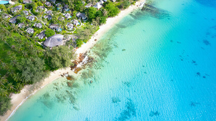 4k video aerial view of the beautiful tropical paradise beach of the Andaman Sea. amazing view Turquoise water waves into the rocky shore.