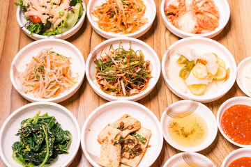 Spicy Kimchi group. Korean pickle or Pickled radish vegetables and seasoning on bowl on wood table background, Japanese food