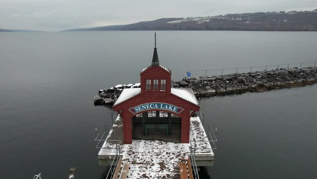 Aerial View of Seneca Lake Boat House and Breakwater in Watkins Glen, New York, USA, Close Up Drone Shot