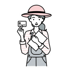 立って書類とカードを手に持つ農家の女性