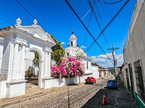 Exterior of the Santa Lucia church and bougainvillea in Suchitoto, El Salvador
