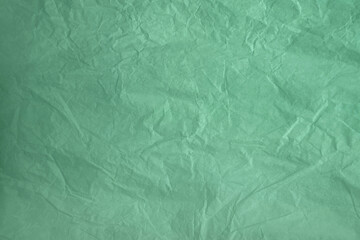 Empty eco friendly pastel green Neo mint or Aqua menthe color on recycled organic crumpled paper for the environment creative style background