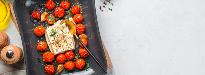 Oven-baked feta cheese with cherry tomatoes, cooking fetapasta.
