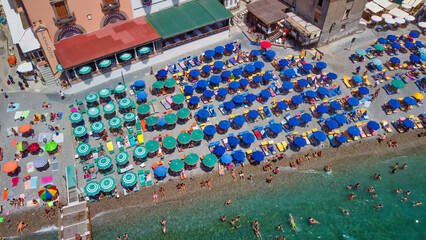 Overhead aerial view of beautifull summer beach with umbrellas, Amalfi Coast.