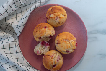 sweet vanilla raspberry muffins on a table